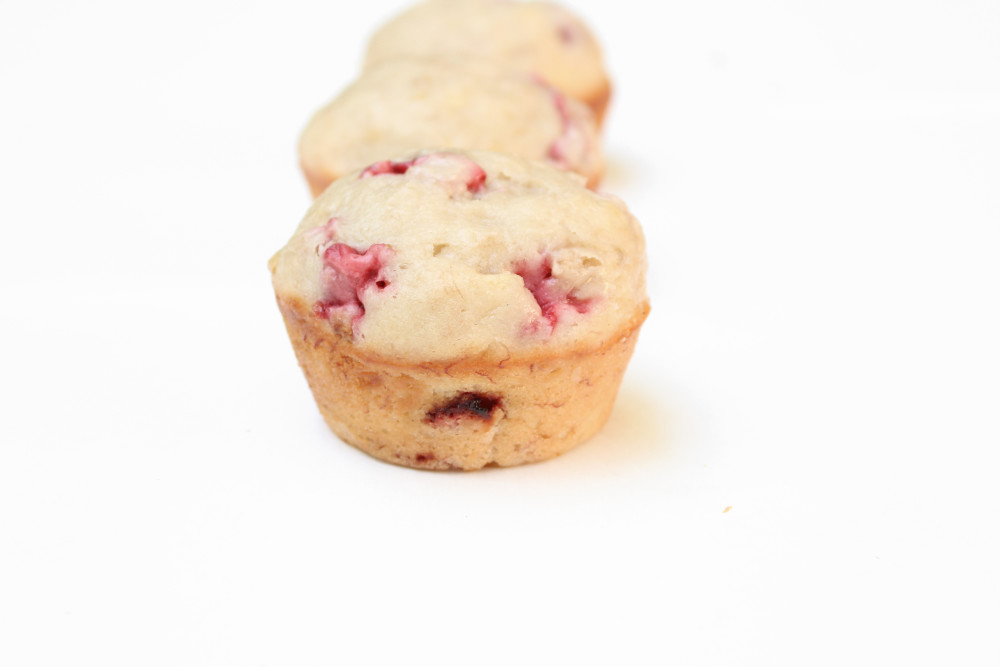 Simple strawberry banana muffins in a row